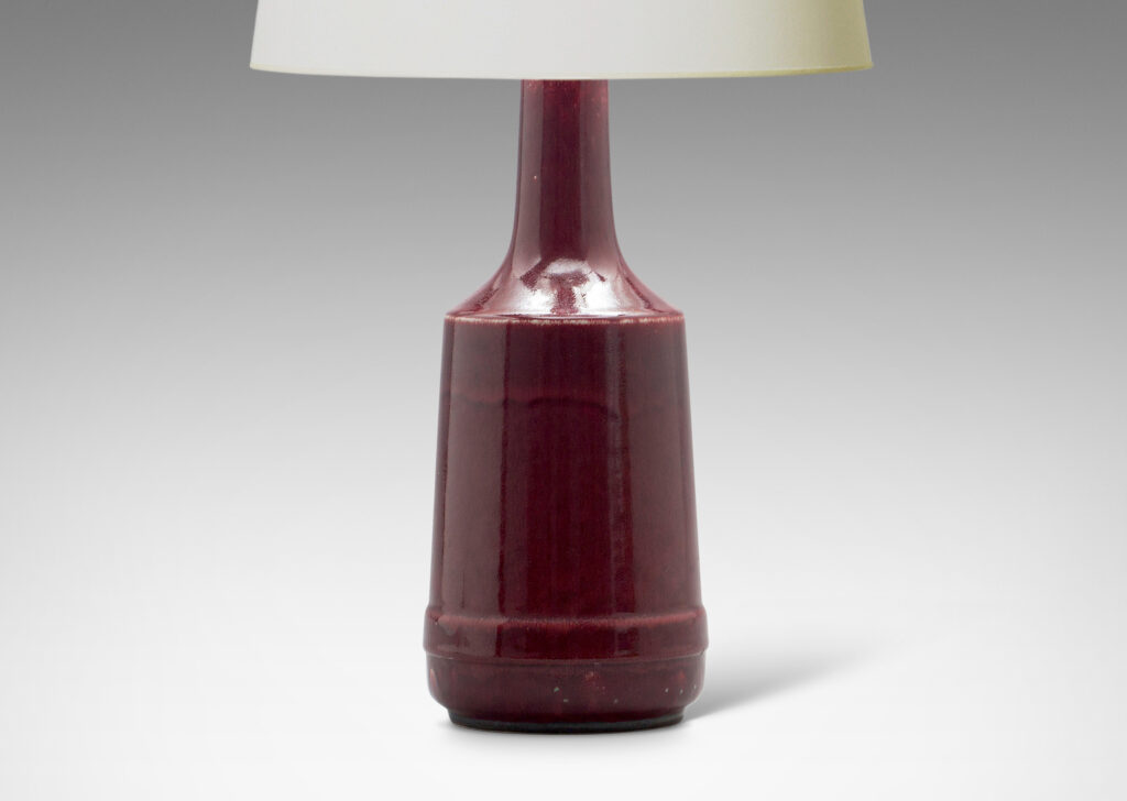 Gallery BAC angled bottle form in an oxblood glaze; stoneware