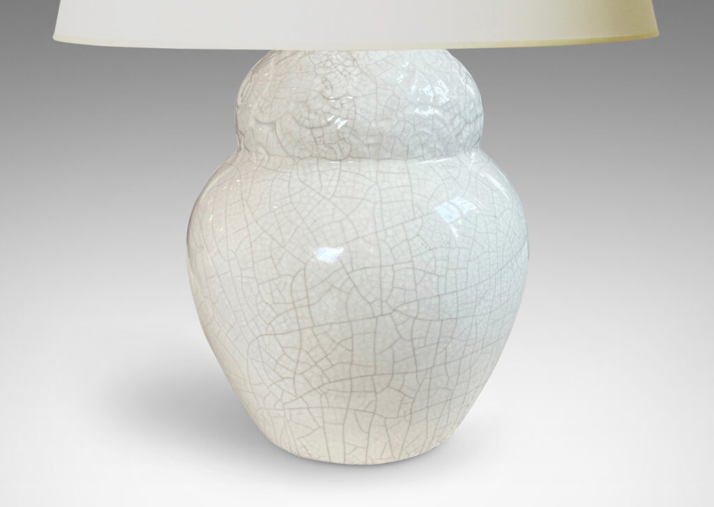 Gallery BAC lobed gourd form with relief band of stylized flora and white craquel glaze