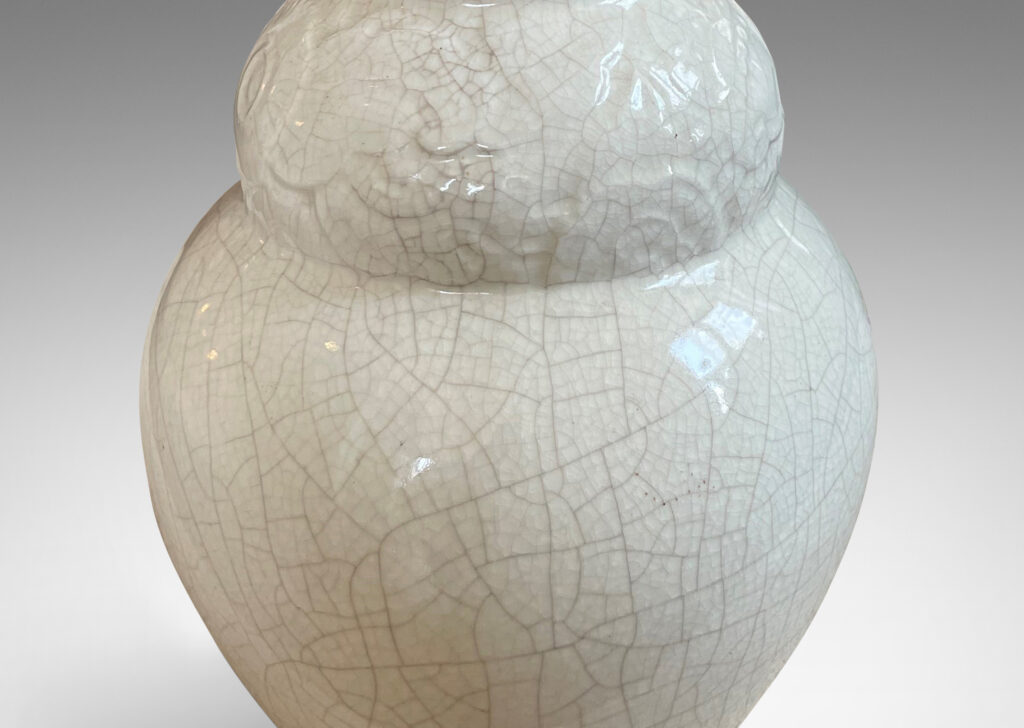 Gallery BAC lobed gourd form with relief band of stylized flora and white craquel glaze