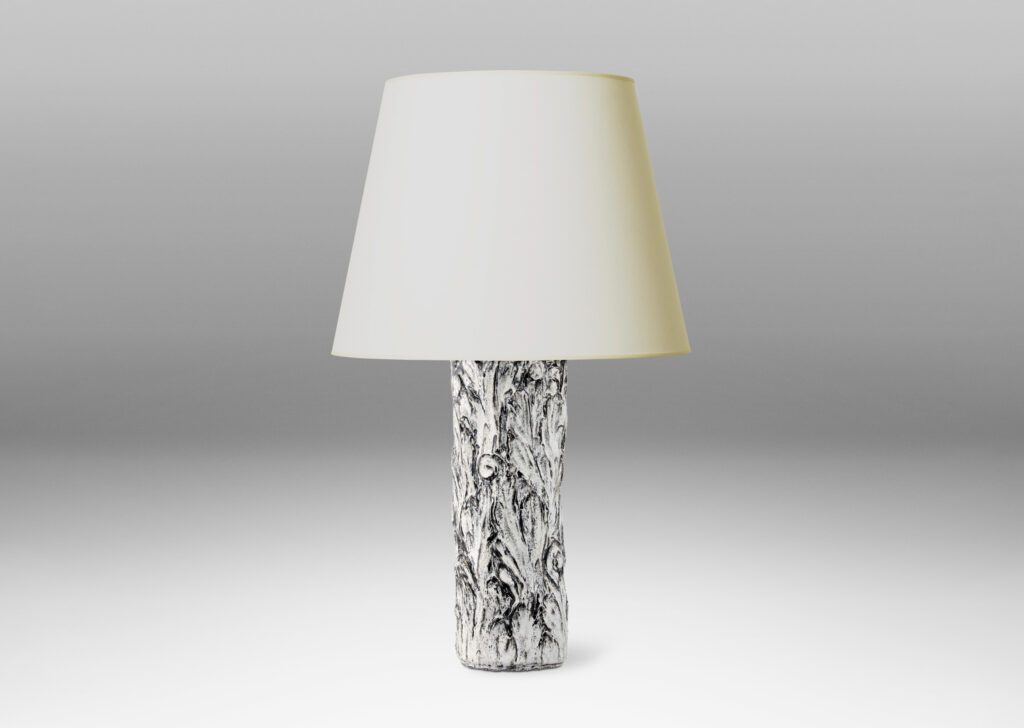 Gallery BAC columnar bases hand-carved with an energetic acanthus leaf pattern in deep relief, further articulated with a white-black tin glaze