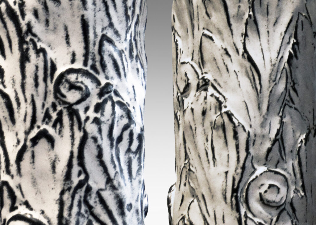 Gallery BAC columnar bases hand-carved with an energetic acanthus leaf pattern in deep relief, further articulated with a white-black tin glaze