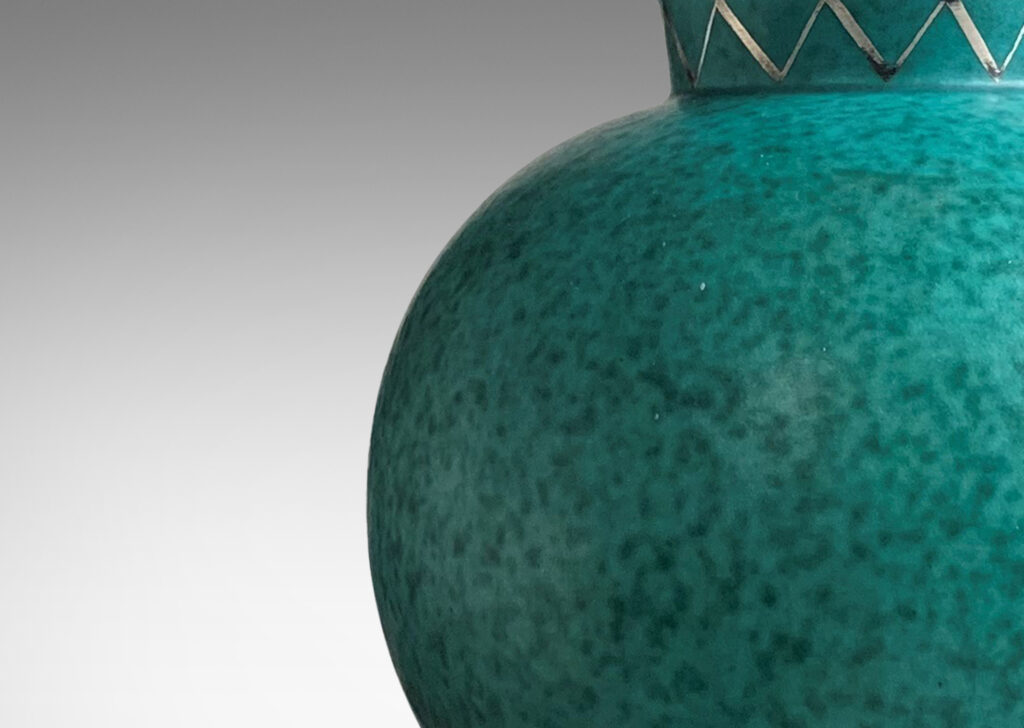 Gallery BAC globe form with flanged neck and base in mottled blue-green with inlaid silver zig-zag ornaments