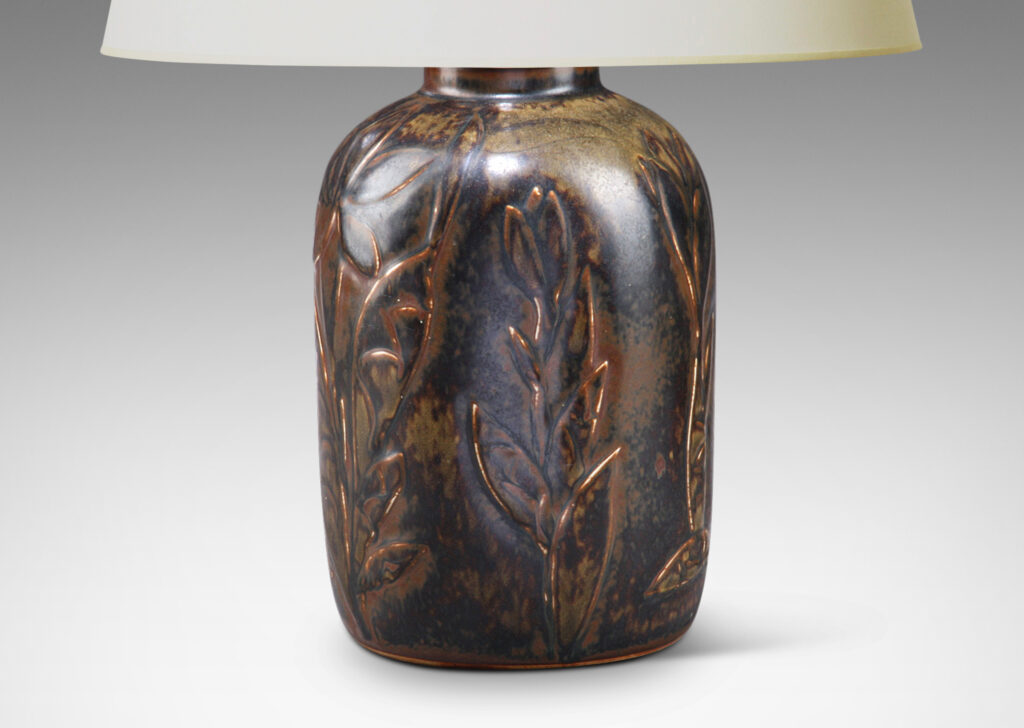 Gallery BAC cylindrical form with rounded edges ornamented with applied abstracted flowers in deep brown