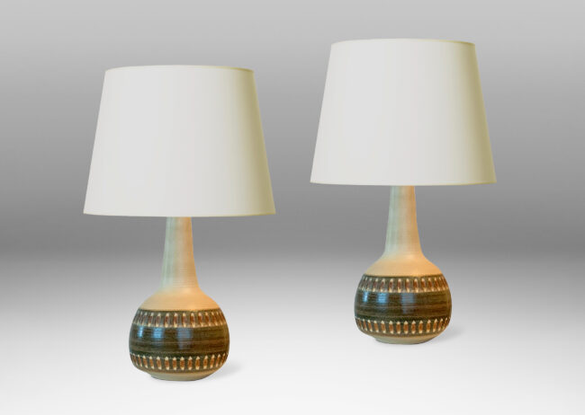 Gallery BAC low round bases with tall tapering necks, carved ovoid details, and matte tan, moss green and russet glazing