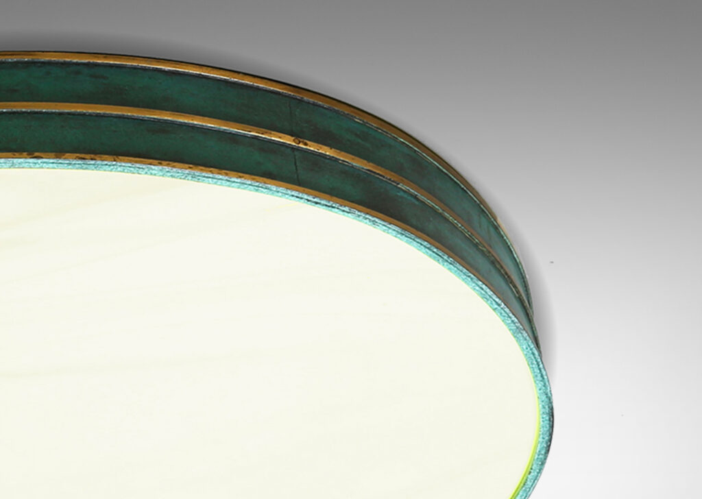 Gallery BAC round frame in metal with verdigris patination and polished bronze