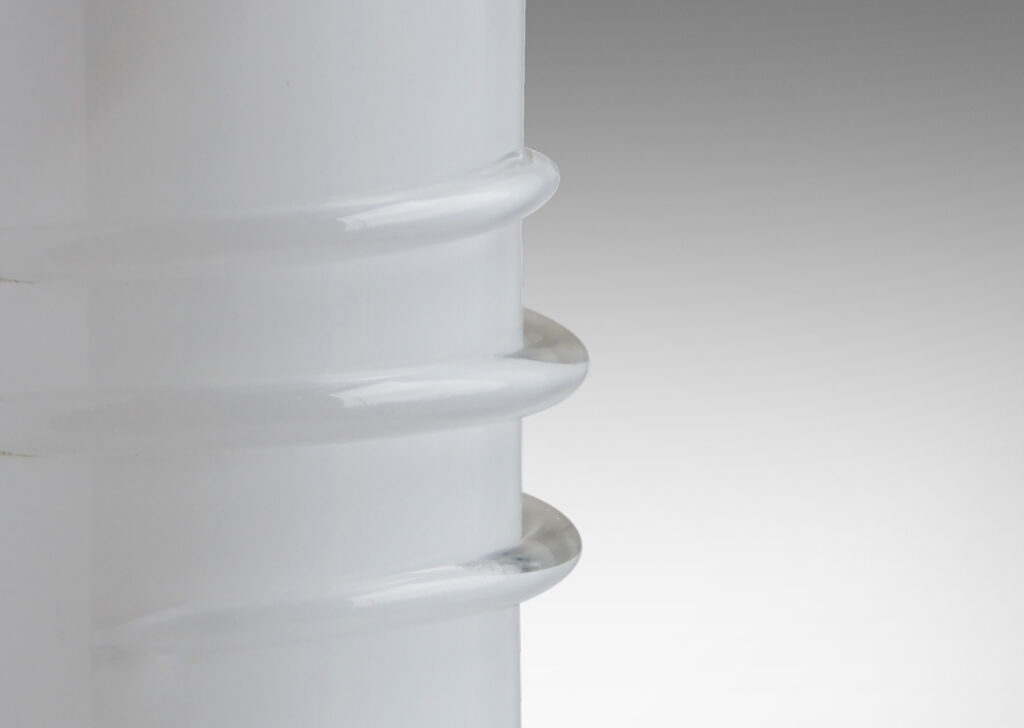 Gallery BAC large round column bases with flanged feet edged in a roll and with applied coils at mid-height