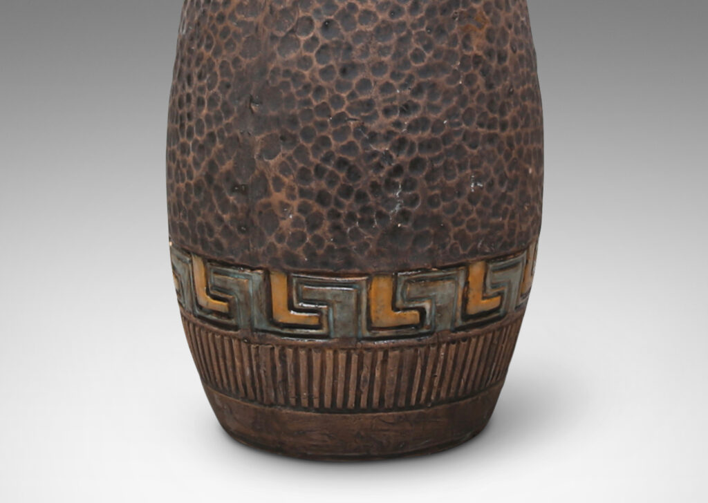 Gallery BAC bullet-like form with a carved dimpled pattern like hammered metal