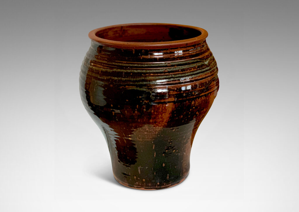 Gallery BAC welling form with turning ring texture, glazed in a black-red luster