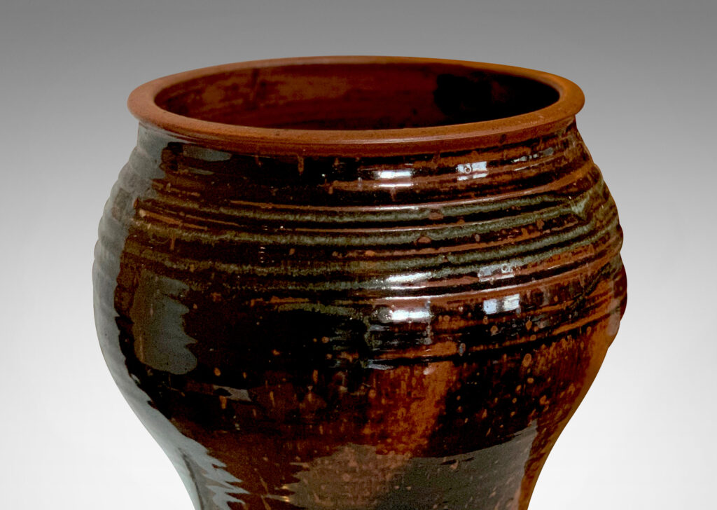 Gallery BAC welling form with turning ring texture, glazed in a black-red luster