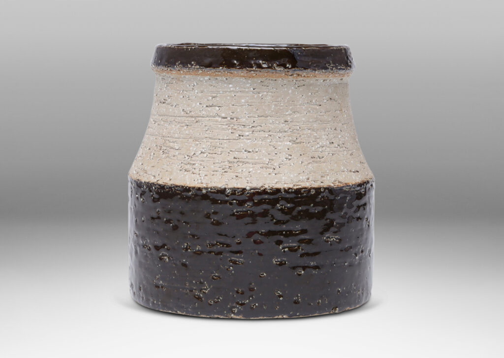 Gallery BAC wide low drum form with cove neck and mouth in grog stoneware, partially glazed in a dark chocolate brown