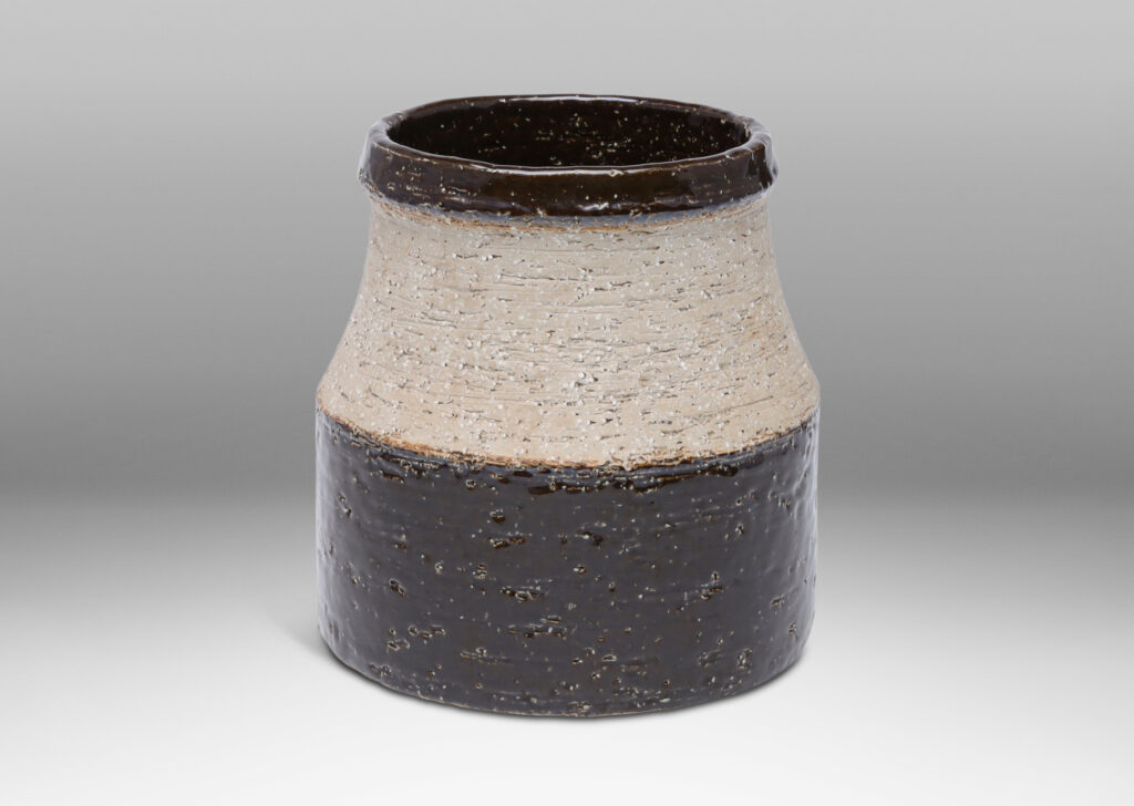 Gallery BAC wide low drum form with cove neck and mouth in grog stoneware, partially glazed in a dark chocolate brown