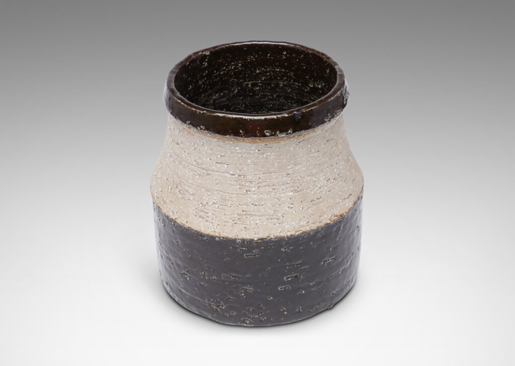 Gallery BAC wide low drum form with cove neck and mouth in grog stoneware, partially glazed in a dark chocolate brown