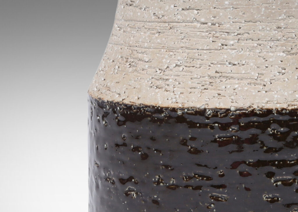 Gallery BAC wide low drum form with cove neck and mouth in grog stoneware, partially glazed in a dark chocolate brown