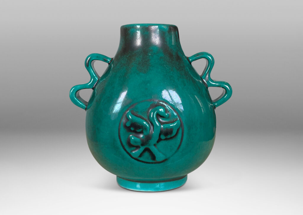 Gallery BAC bulbous form with wavy handles and bird motifs in deep teal-toned copper oxide glaze