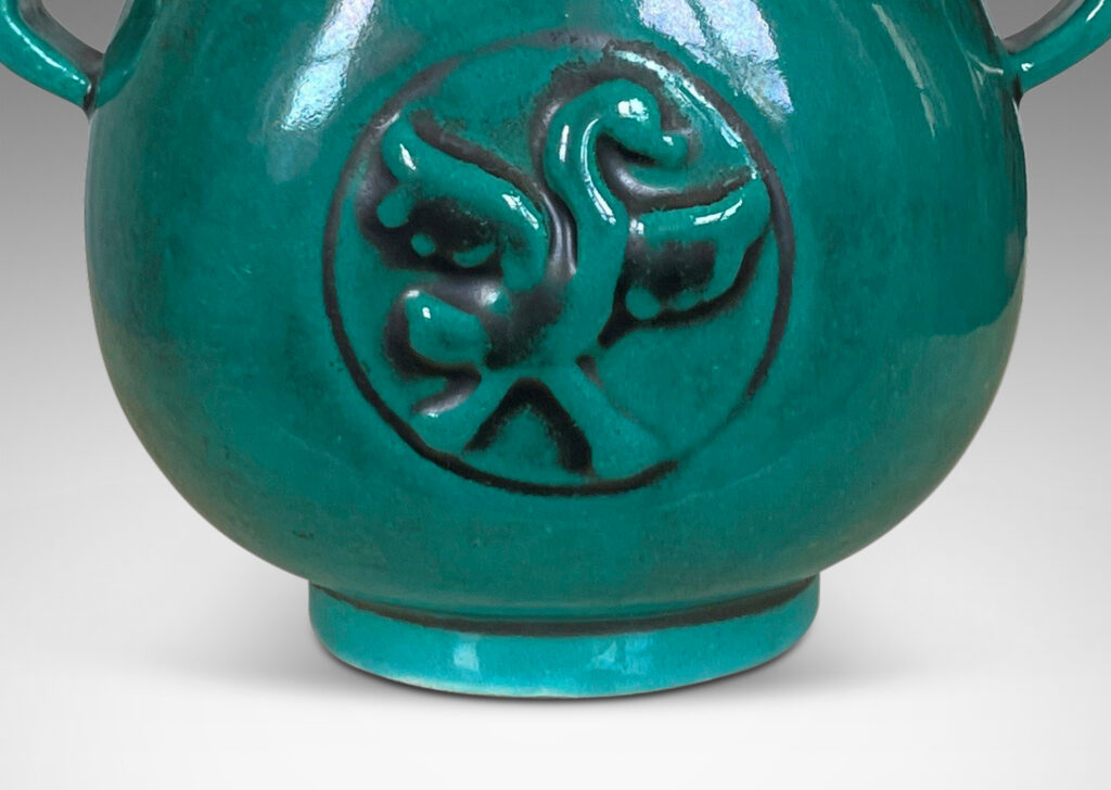 Gallery BAC bulbous form with wavy handles and bird motifs in deep teal-toned copper oxide glaze