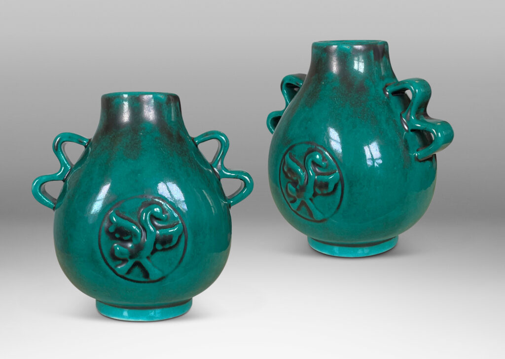 Gallery BAC bulbous form with wavy handles and bird motifs in deep teal-toned copper oxide glaze