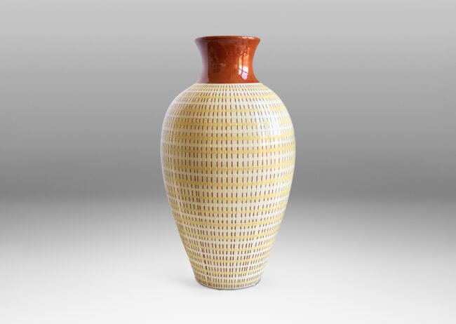 Gallery BAC tall tapering form with a magnificent basket-weave texture using glazing and sgraffito