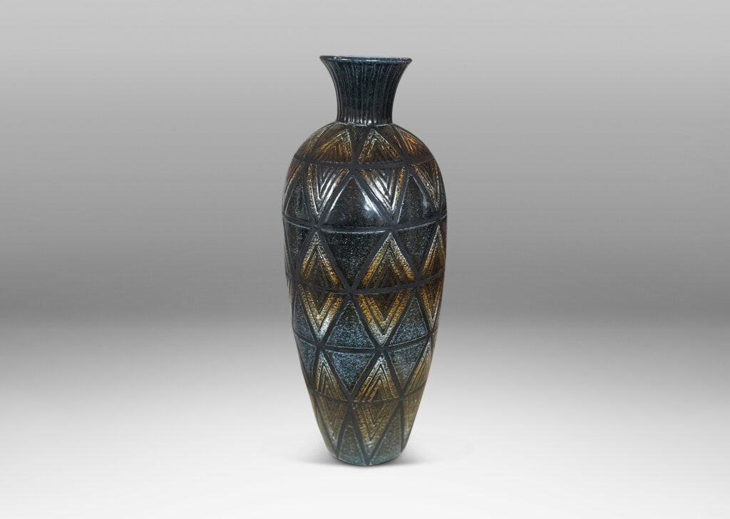 Gallery BAC tall slender tapered form with carved diamond pattern glazed in ethereally applied black and brown