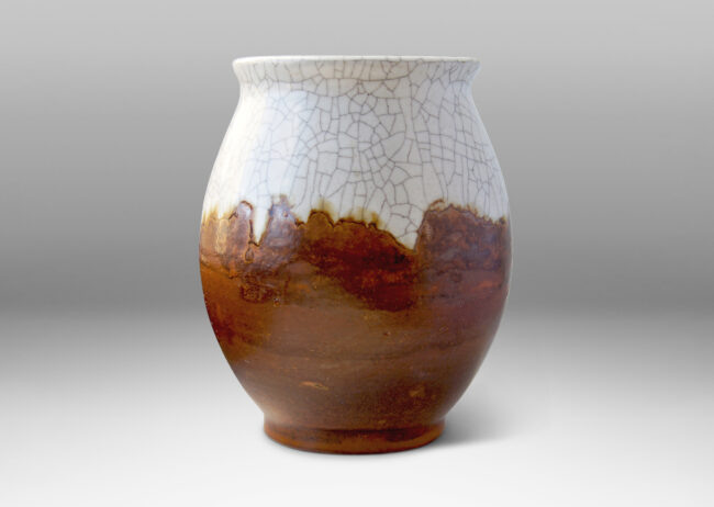 Gallery BAC stoneware with a semi-matte sienna brown glaze with a thick overlapping layer of glossy craquelure glaze overflowing in a free-form way from the top