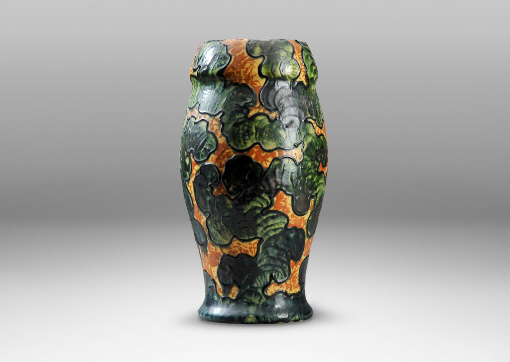 Gallery BAC piped slip “cloisons” applied in an organic, cloud-like patterns glazed in gold-yellow and green; earthenware