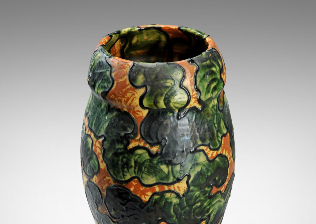 Gallery BAC piped slip “cloisons” applied in an organic, cloud-like patterns glazed in gold-yellow and green; earthenware