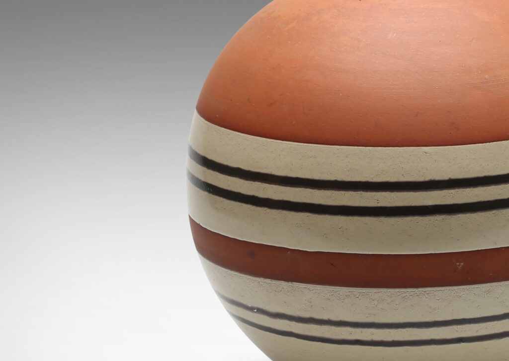 Gallery BAC spherical form with vertical spout and handle in terra cotta earthenware partially glazed in pale gray and brown stripes