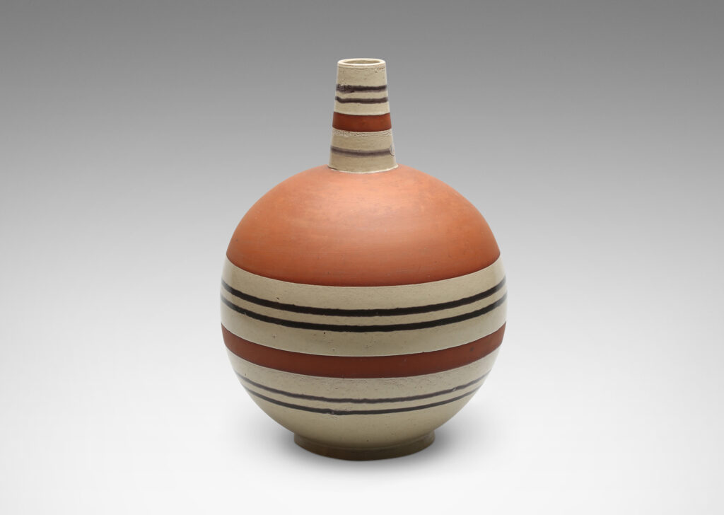 Gallery BAC spherical form with vertical spout and handle in terra cotta earthenware partially glazed in pale gray and brown stripes