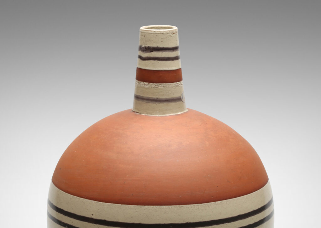 Gallery BAC spherical form with vertical spout and handle in terra cotta earthenware partially glazed in pale gray and brown stripes