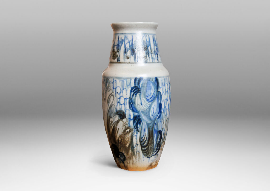 Gallery BAC sturdy tapering form with wide neck and angled lip with a hand-painted design of cloud-like swirls suggesting abstract flora and festoons against an airy scalloped pattern of a vaguely Asian character in blue and gray over pale gray