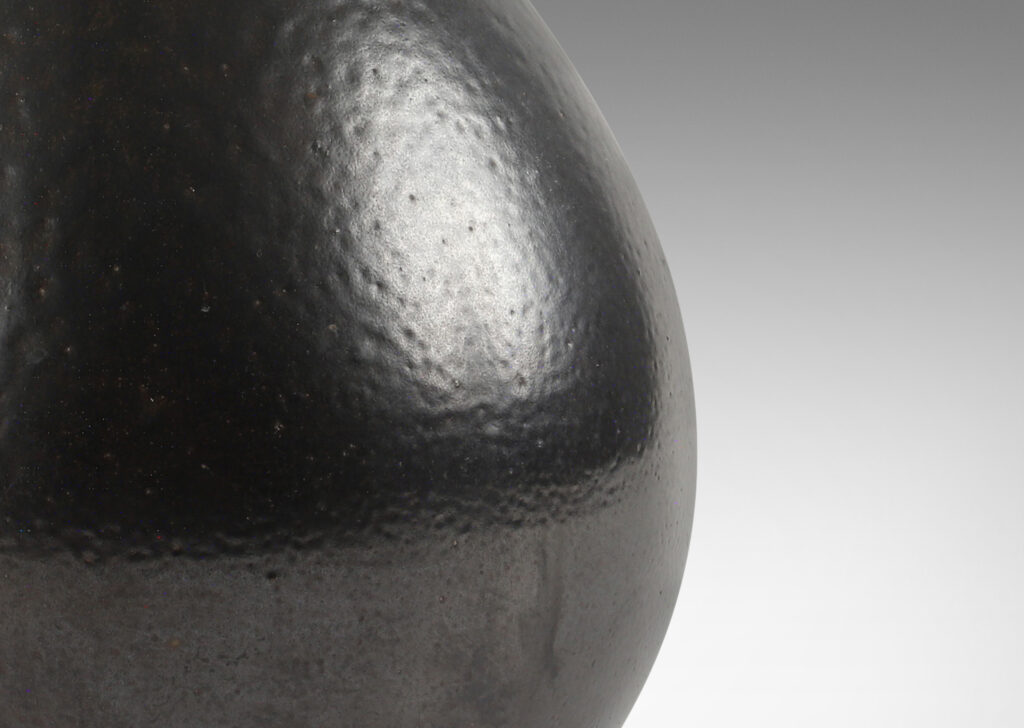 Gallery BAC organically modeled drop form with subtly carved dimpled texture in a rich ganache brown