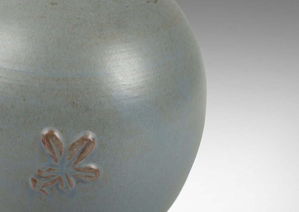 Gallery BAC globe form with flared neck and floral motif in pale gray-blue