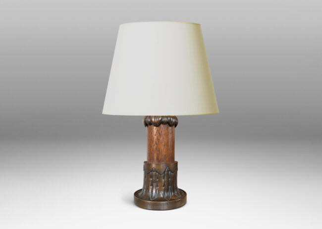 Gallery BAC cap and base decorated with stylized foliage in patinated bronze with a solid oak stand