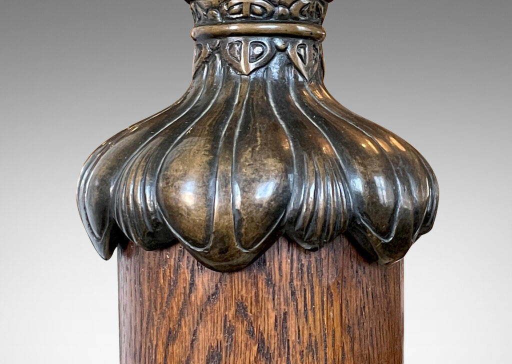 Gallery BAC cap and base decorated with stylized foliage in patinated bronze with a solid oak stand