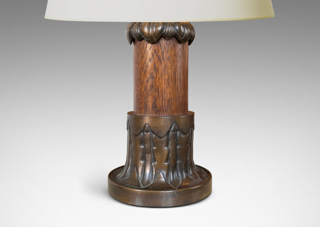 Gallery BAC cap and base decorated with stylized foliage in patinated bronze with a solid oak stand