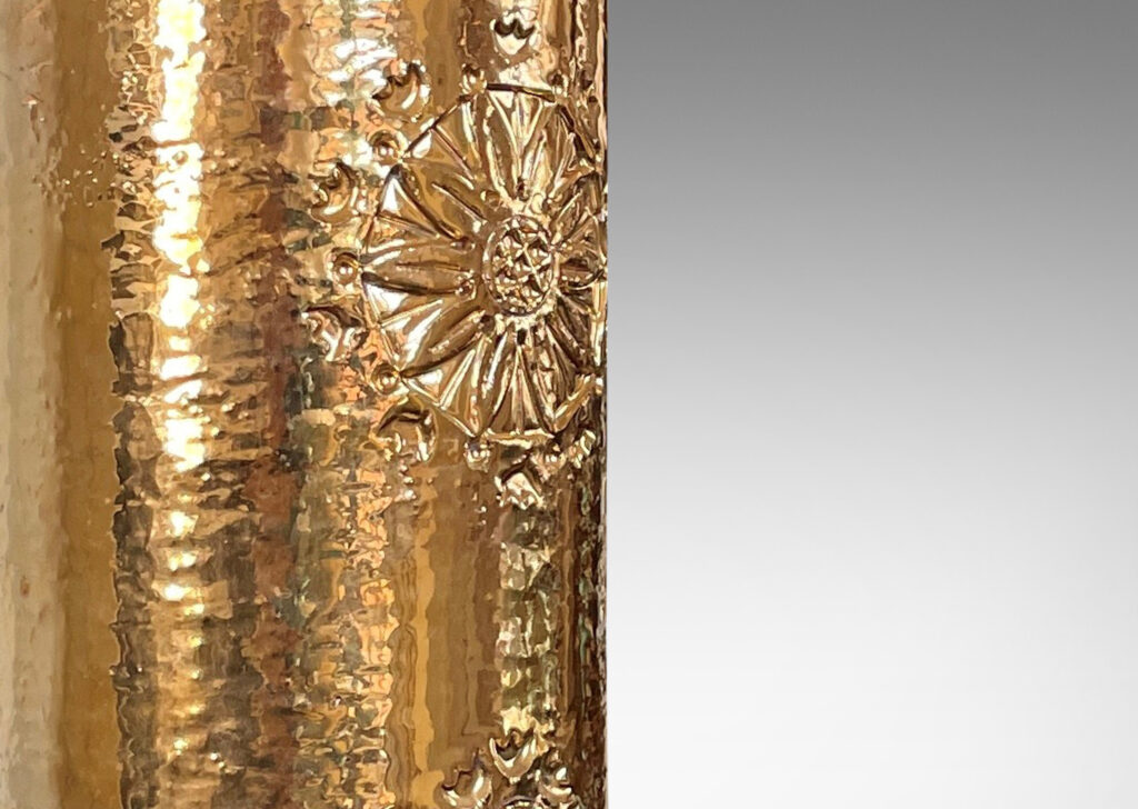 Gallery BAC canister forms with intaglio medallion motifs and thick gold luster glaze