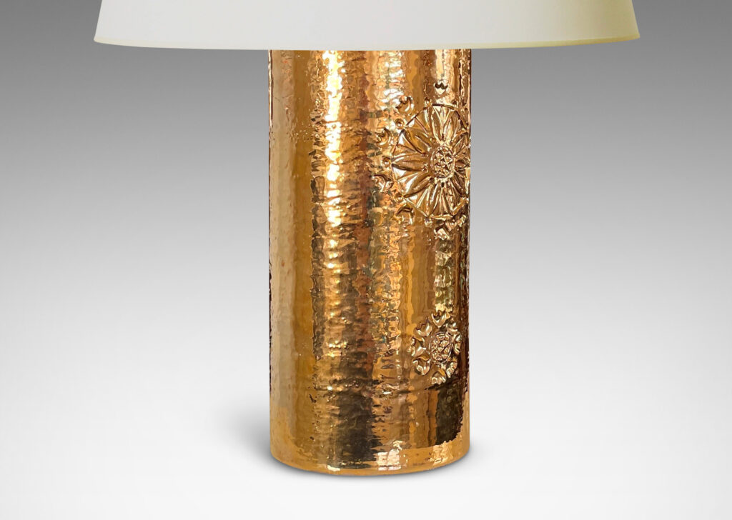 Gallery BAC canister forms with intaglio medallion motifs and thick gold luster glaze