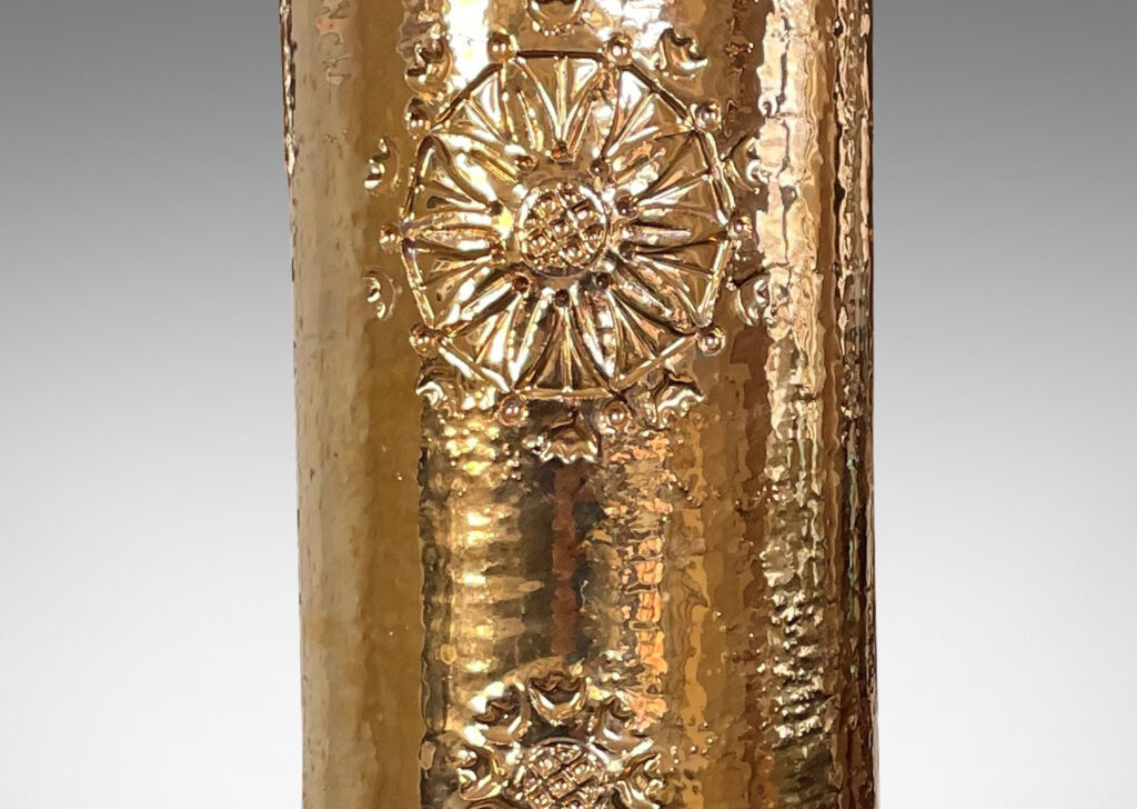 Gallery BAC canister forms with intaglio medallion motifs and thick gold luster glaze