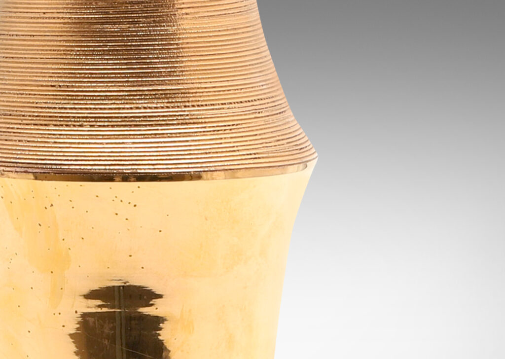 Gallery BAC notched column form with carved ridging detail; earthenware with a brilliant gold luster glaze