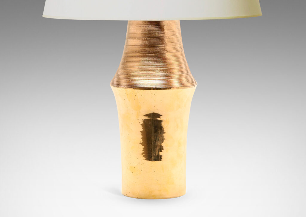 Gallery BAC notched column form with carved ridging detail; earthenware with a brilliant gold luster glaze