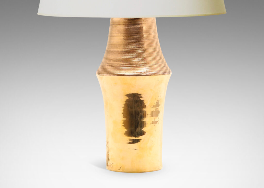 Gallery BAC notched column form with carved ridging detail; earthenware with a brilliant gold luster glaze