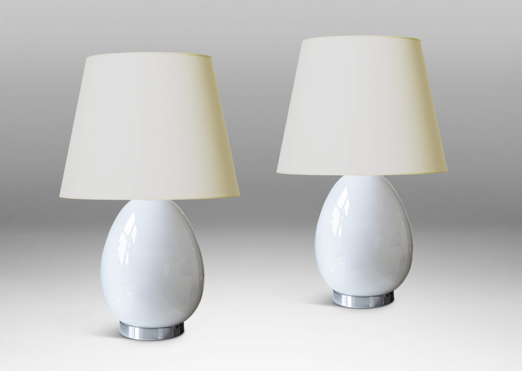 Gallery BAC egg-like forms in white opaline glass mounted to steel stands and bases