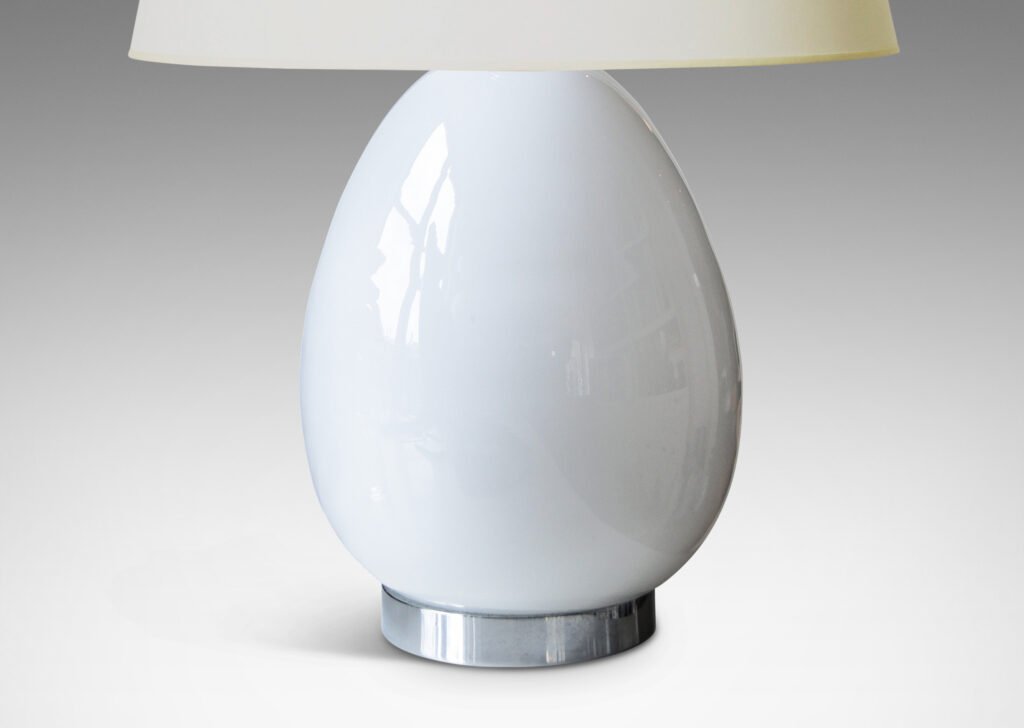 Gallery BAC egg-like forms in white opaline glass mounted to steel stands and bases