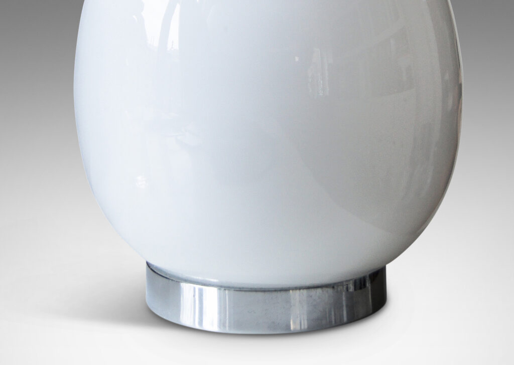 Gallery BAC egg-like forms in white opaline glass mounted to steel stands and bases