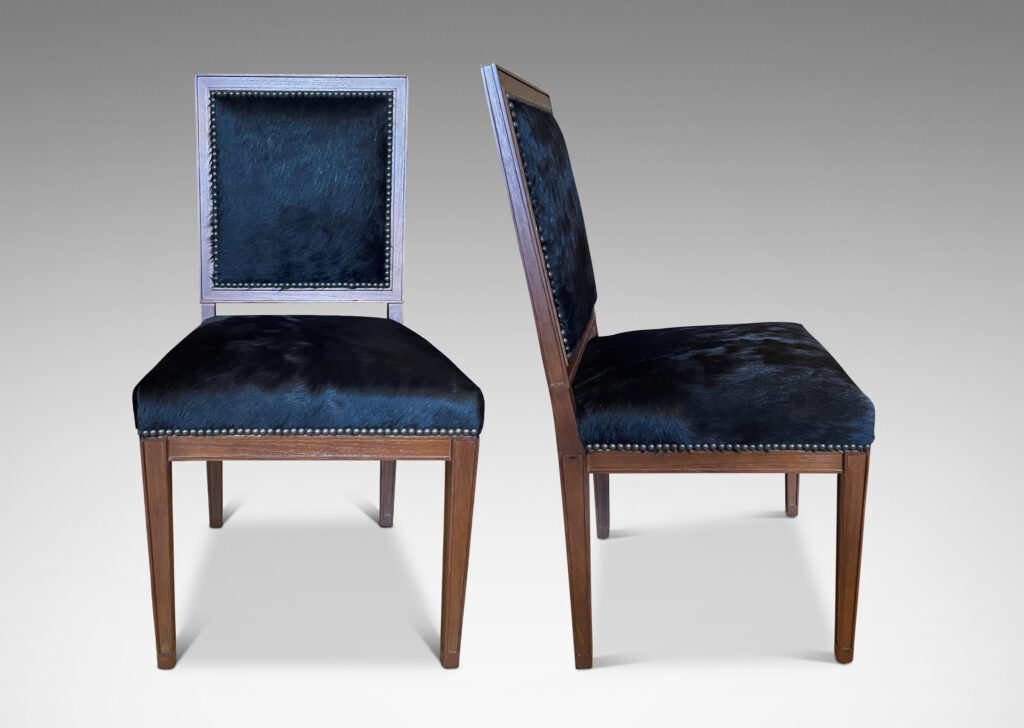 Gallery BAC rationalized Louis XVI style frames with square backs and tapered legs crafted in teak, with black cowhide upholstery