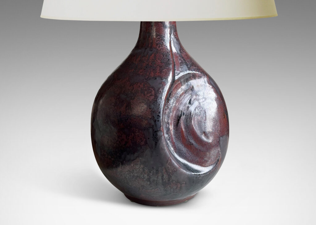 Gallery BAC sculptural bulbous form with round inset design in a burgundy/oxblood-gunmetal luster glaze