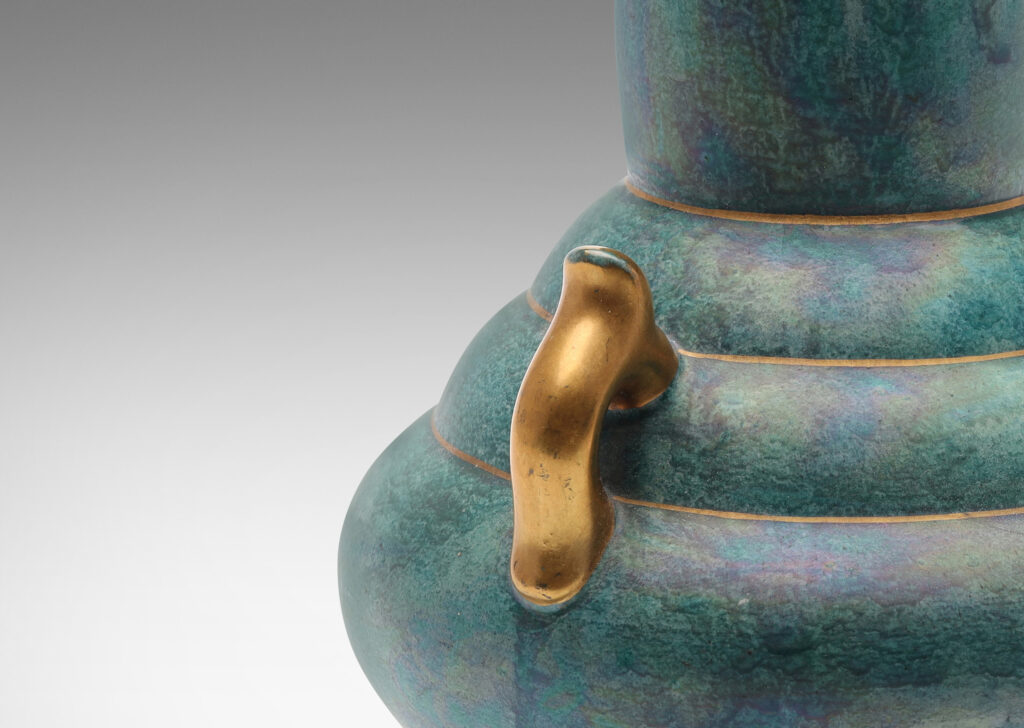 Gallery BAC undulating form in a sponged green luster glaze with gilded bracket handles