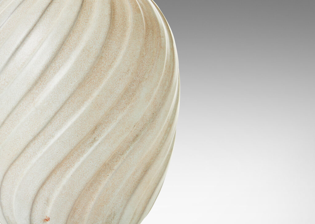 Gallery BAC ovoid form with swirling vertical flutes, in a cool ivory glaze with toasty accents