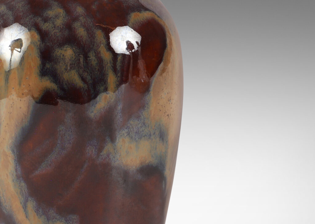 Gallery BAC classic vase form in a rich burnt sienna with scrolling pattern in pale taupe luster glaze