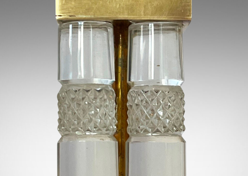 Gallery BAC four tapered crystal columns with diamond-cut bands, with square brass mounts