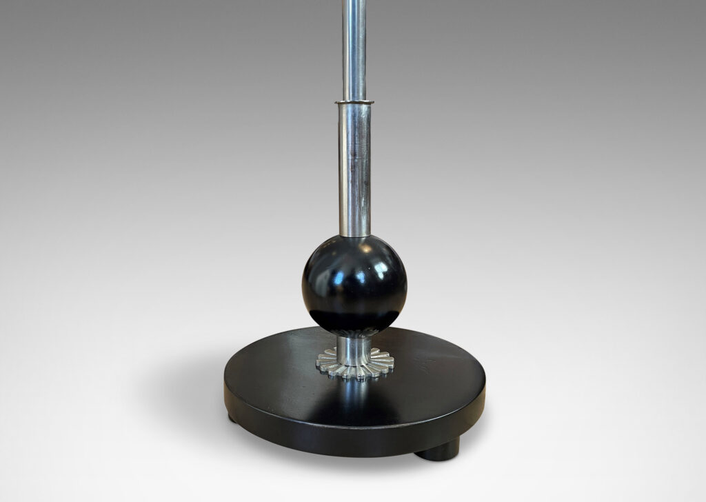 Gallery BAC telescoping stand that allows for height adjustment, with a floating disk base with a rosette motif and a suspended sphere fob